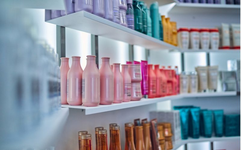 To help you lean how to clarify hair, a bunch of product sit on a well-lit store shelf