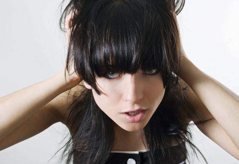 Long bangs for girls on emo hair while girl growls and holds her ears