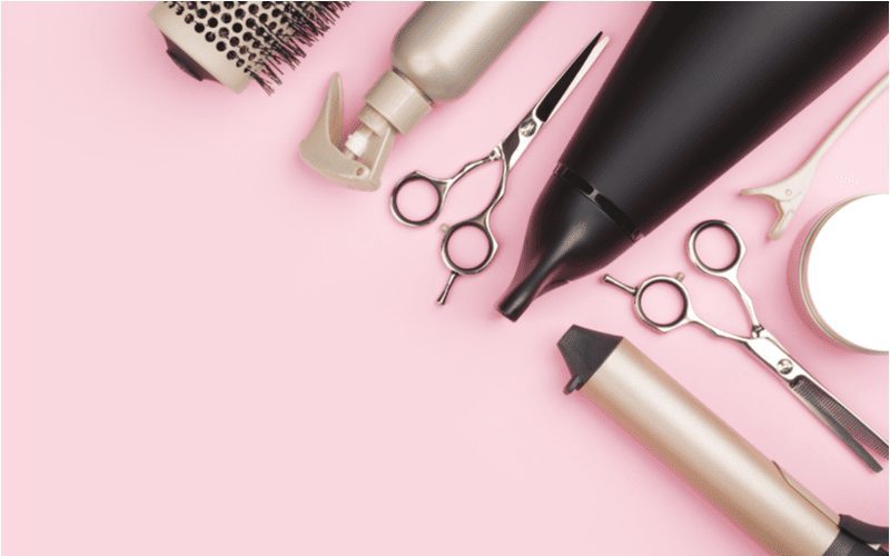 As an image for a piece on how to make your hair grow faster, a number of hair tools in a layflat image to symbolize the different routines to protect against hair damage