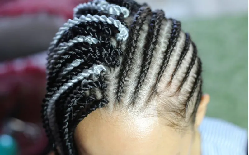 For a piece on how to do box braids, a close-up shot of a woman with blonde and black hair braided into box braids