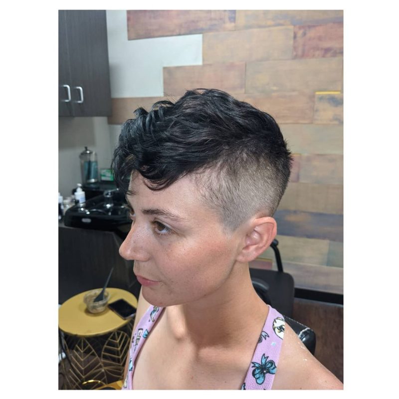 Peaky blinders inspired female mohawk with a big fade and fluffy hair on top