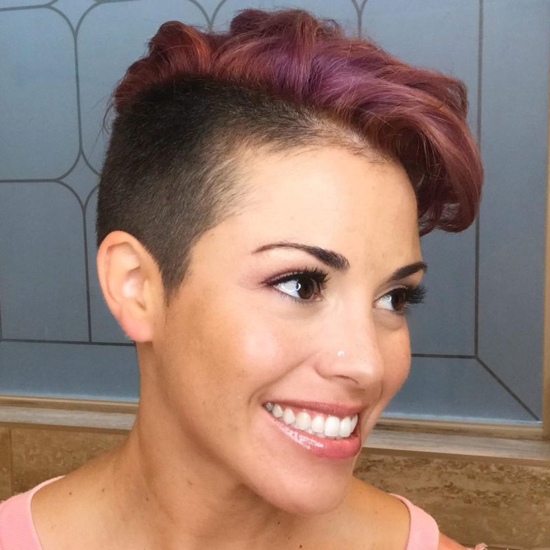 Two tone mohawk for females on a smiling woman with a partial fade