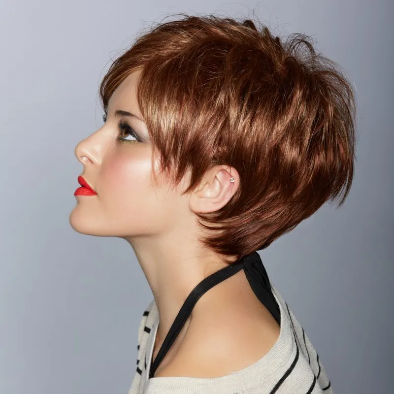 Short and sleek feathered hair on a woman looking upward and wearing a striped shirt