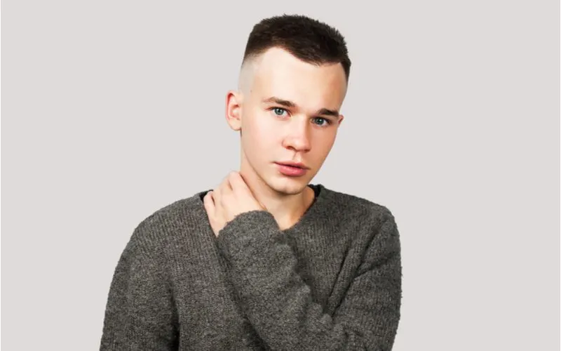 Example of a guy in a wool sweater wearing a military-style low fade haircut