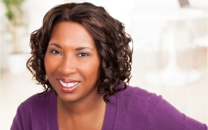 Woman with a loose curly bob haircut for black women