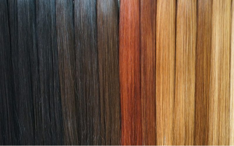 Image showing the various shades of hair extension colors for a piece on what is brassiness in hair