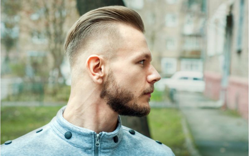 Side profile image of a man with a Pompadour Bald Drop Fade