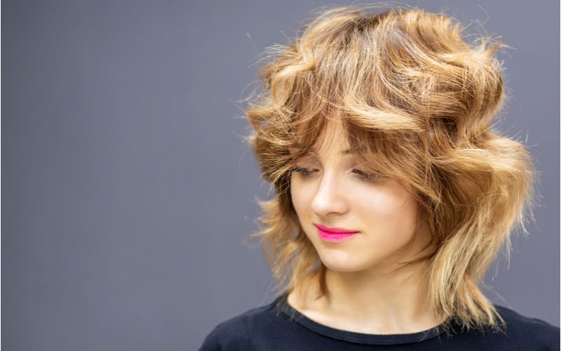 Wolf Cut Curly Shag Lob on a woman with fair skin and small lips