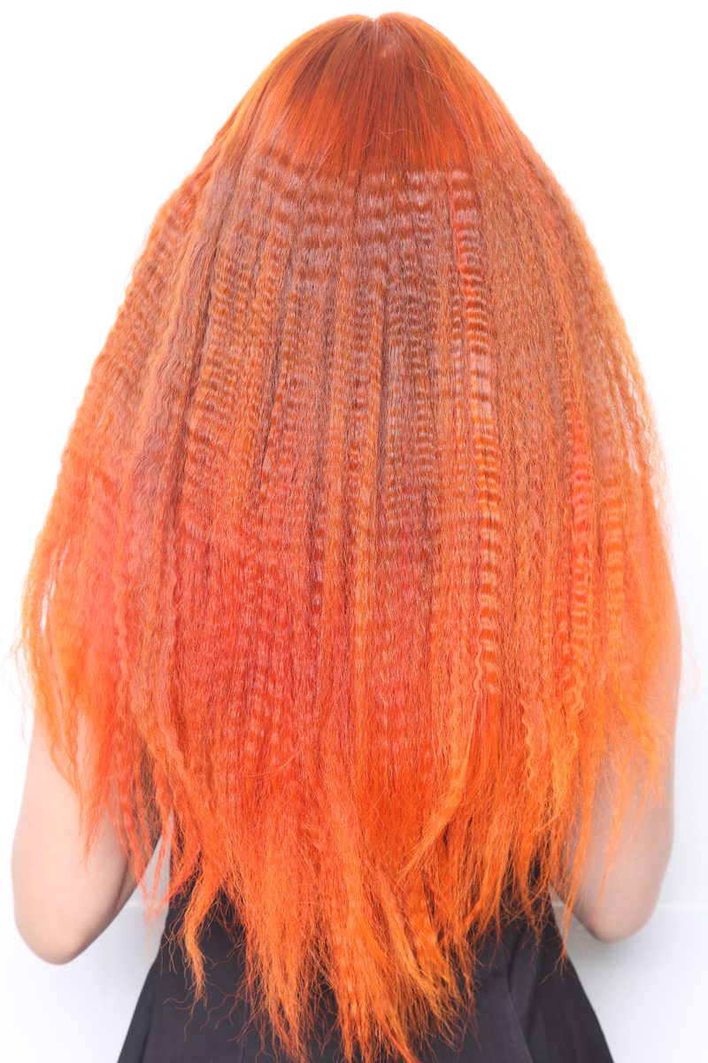 Woman with crimped copper red hair for a piece on punk hairstyles