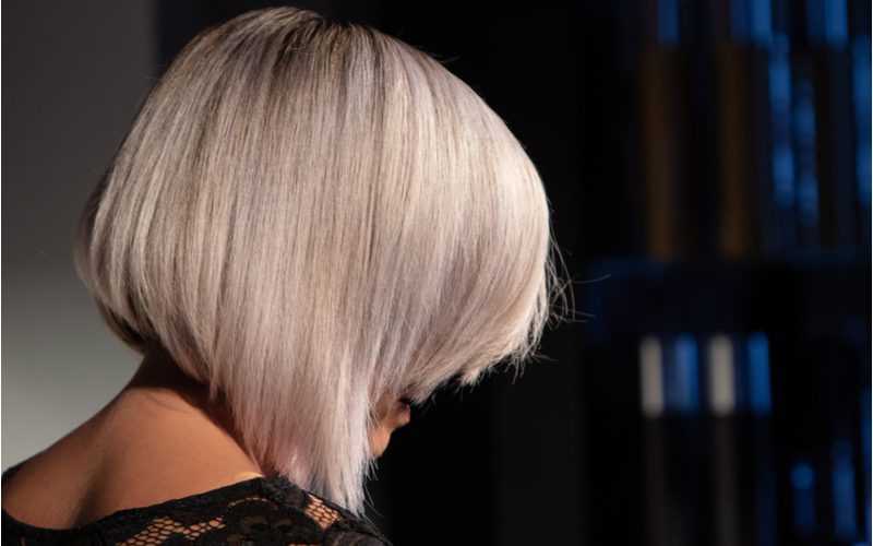 Silvery Lilac A-Line Bob on a woman in a black lace dress