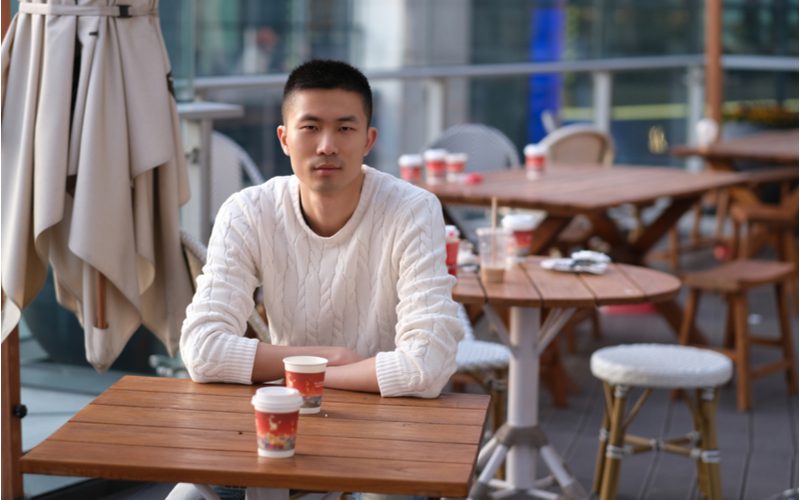 Brush cut buzz cut idea on an Asian man in a fancy white sweater