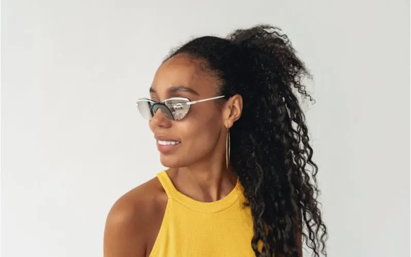 Half-Up Messy Ponytail black hairstyle on a pretty woman in glasses