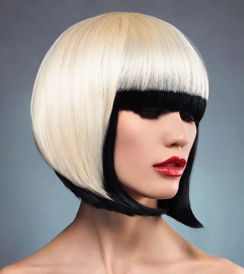 Color contrast on a woman with blonde hair with black ends wearing red lip with a face-framing inverted bob