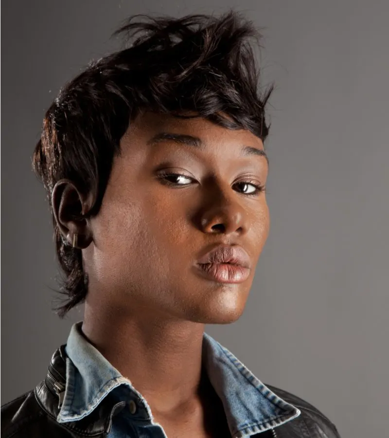 Messy Faux Hawk on a woman in a jean shirt under a black leather jacket
