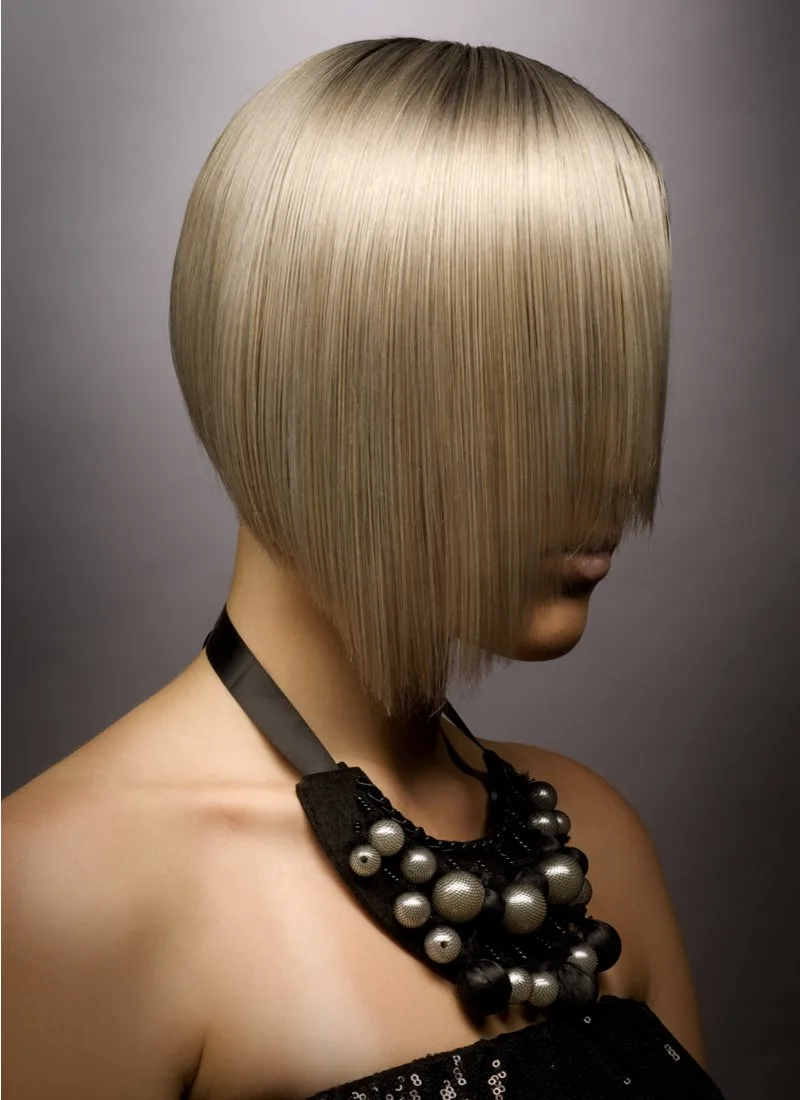 Angled Bob With Face-Framing Layers on a gal with blonde hair wearing a fancy black dress