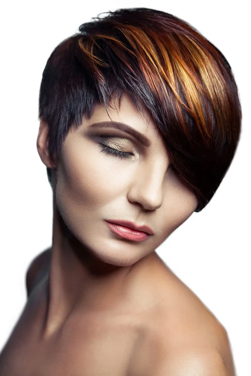 Mulberry, Black, and Gold Bob hair on a woman in a studio who's closing her eyes