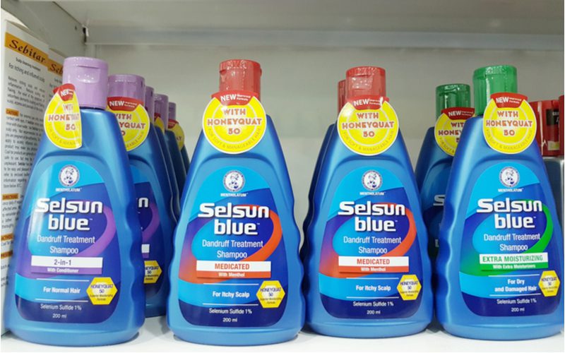 Several bottles of Selsun Blue shampoo to use if you're trying to get rid of dandruff