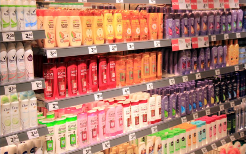 Shelves of a department store lined with the best conditioner from brands like Pantene and Dove