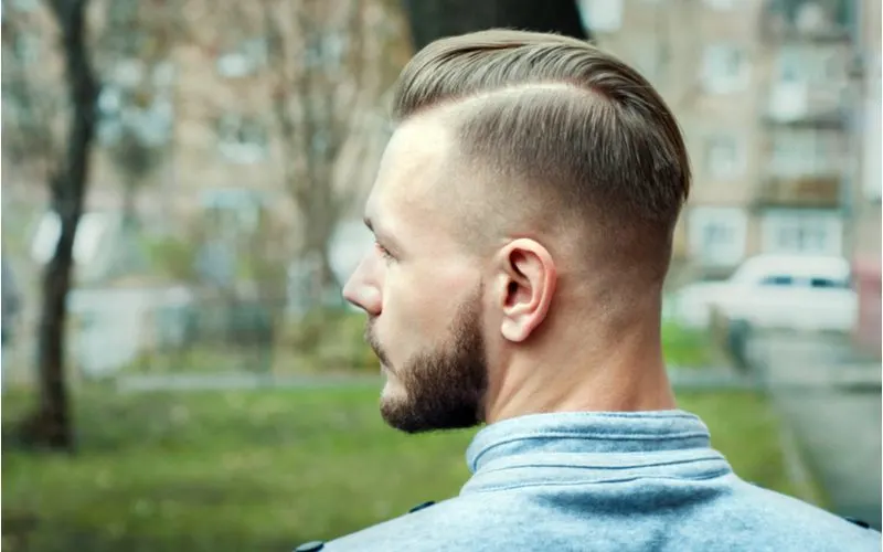 Roundup post for ideas for comb over fades on a guy standing in an alleyway outside