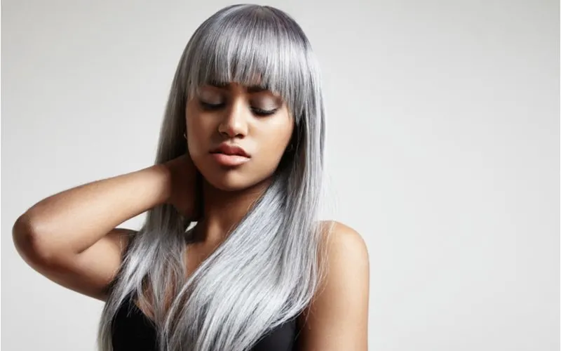 Pretty woman with light brown skin and silver hair coloring