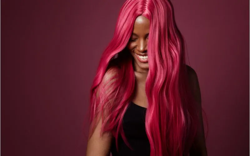 Deep Pinkish Red as an idea for hair colors for brown skin