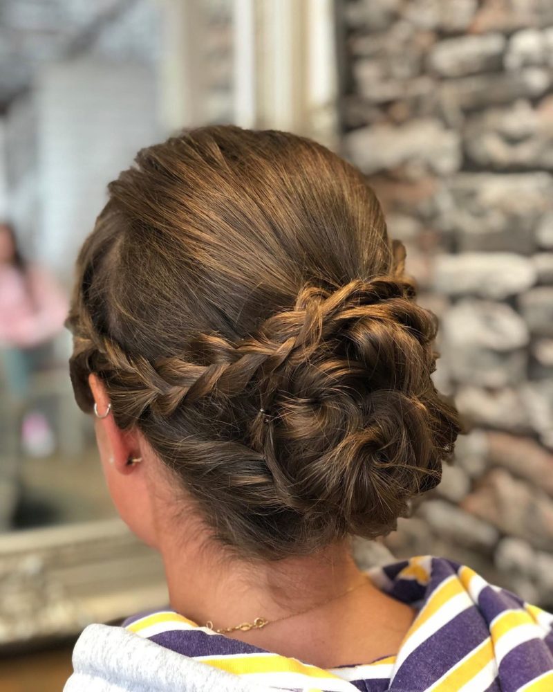 Updo With Braid on the back of a woman's head for a piece on easy updos