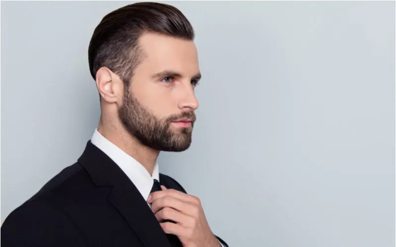 Slicked-Back Pompadour With Short Sides worn by a guy in a suit