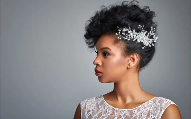 African American bride hairstyle featuring Swept-Up Brushed Curls With Pearly Accents