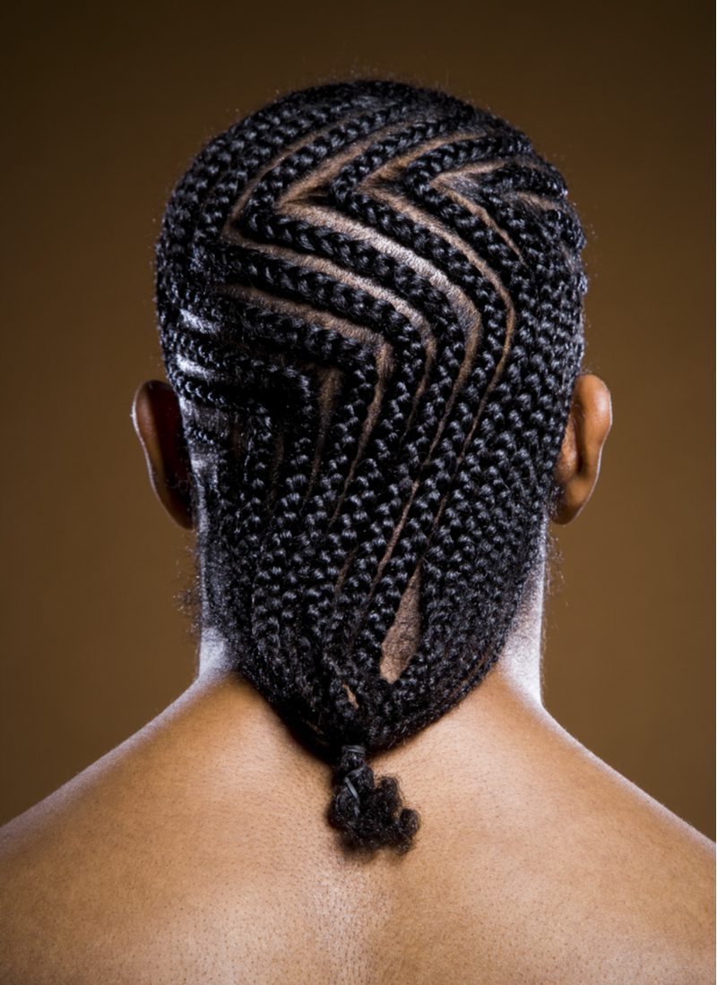 Zig Zag Flat Braids on a guy looking away from the camera for a piece on black male hairstyles