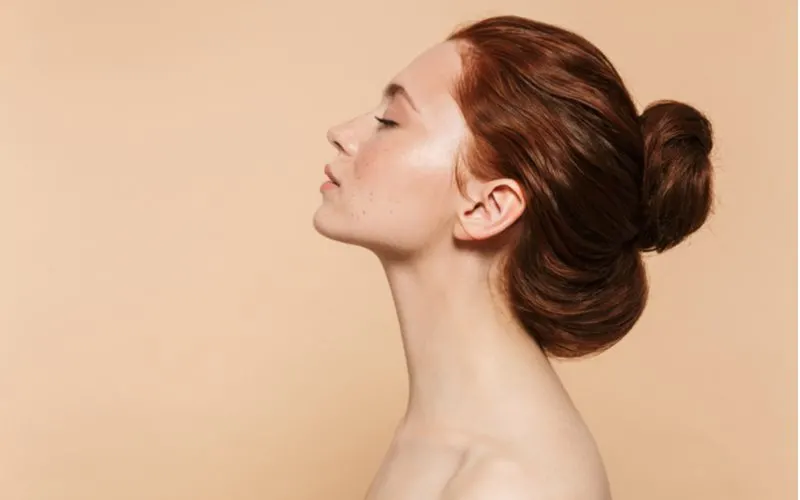 Muted Auburn-Brown Hair on a fair-skinned woman with freckles in a side profile image