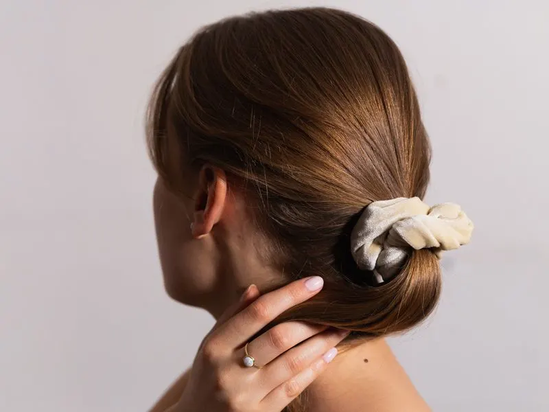 Low Chic Scrunchy Pony featured in a style idea roundup titled Easy Hairstyles