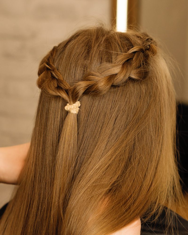 Braided Half-Halo on a gal as viewed from behind for a piece on teenage hairstyles for girls