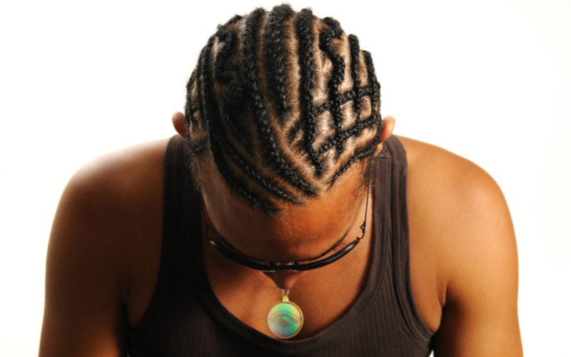 Black male hairstyle pictured in a Criss-Cross Flat Braid style