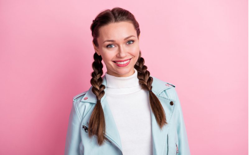 Double French Braids on a Dorothy-looking woman in a blue leather jacket