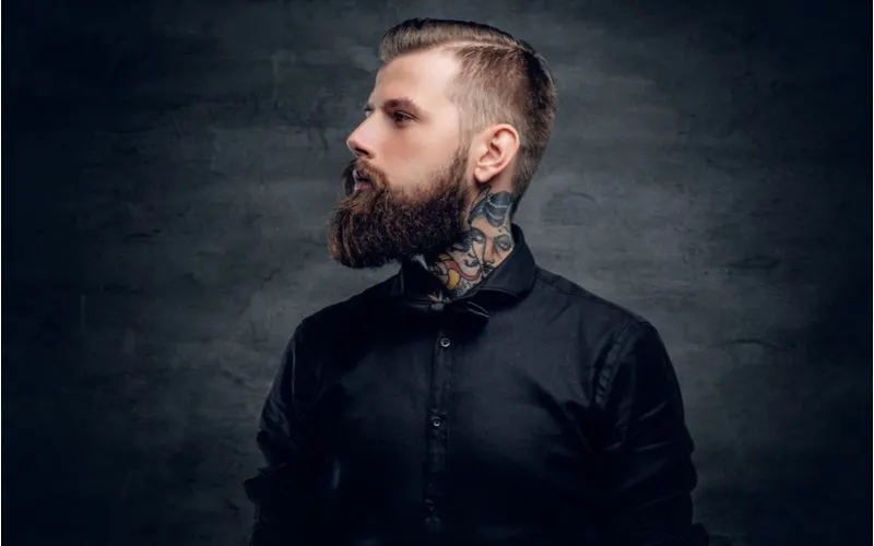 Men's haircut with beard idea with a Mid Comb Over Taper & Full Beard pictured
