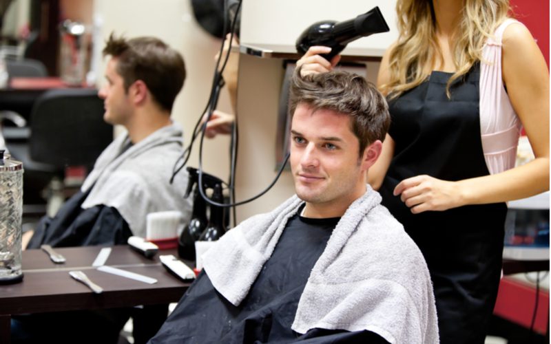 Image of a haircut for a receding hairline featuring the Masculine Styled-Forward Pixie Cut