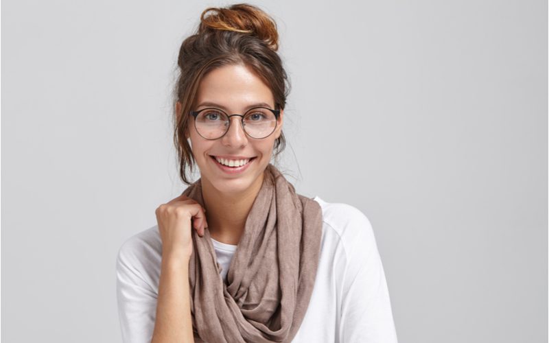 Artsy High Bun With Face-Framing Tendrils as a long to medium length hairstyle example