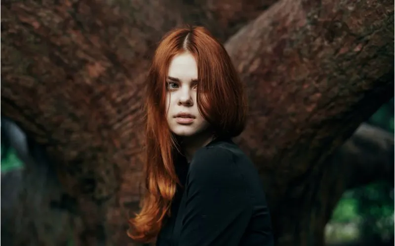 Ethereal Deep Auburn worn by a pale woman with gorgeous long hair in a black shirt