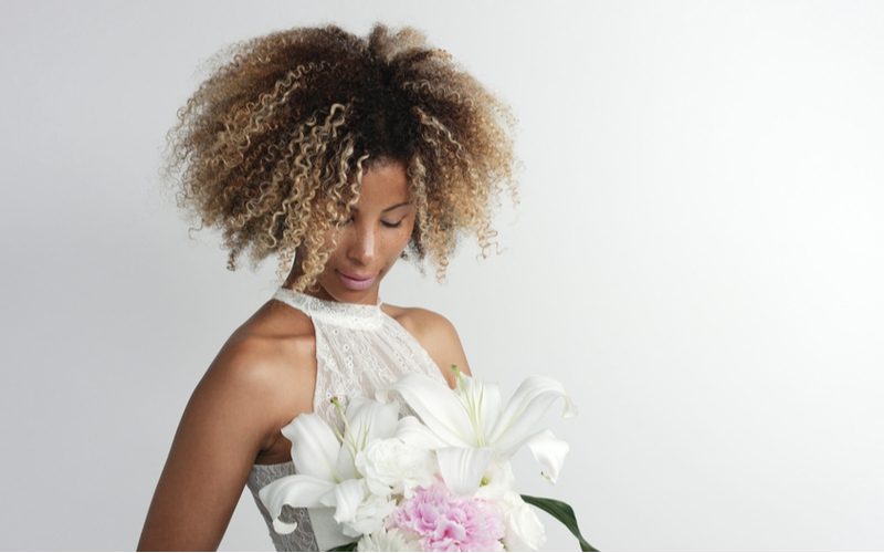 Down and Loose Balayage Coils With Shadow Root as a featured African American bride hairstyle