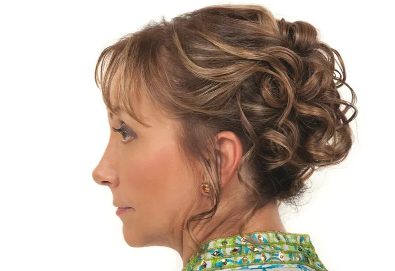A perfect hairstyle for women over 40 is the Formal Updo With Touchable Curls