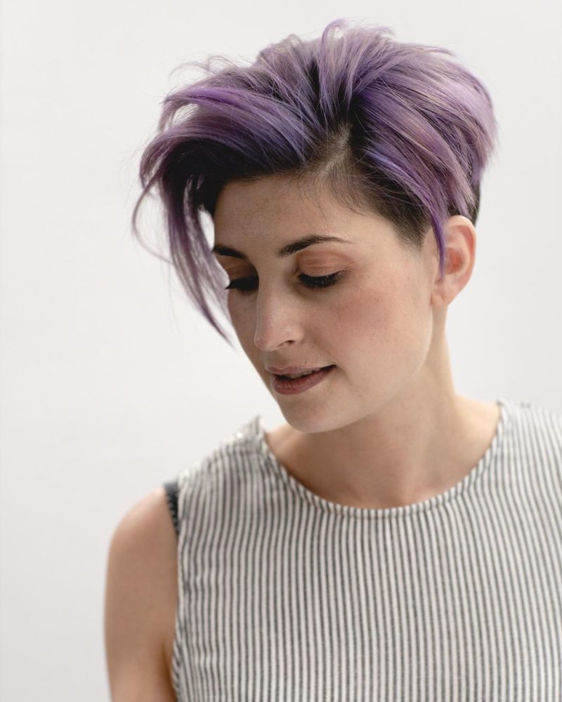 Tousled Lavender Undercut on a woman with a long pixie for a piece on black and purple hair