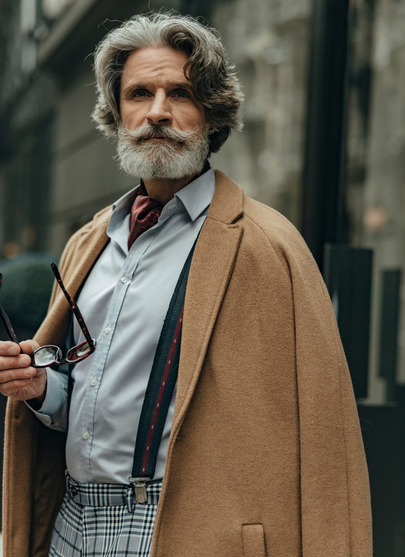 Distinguished Silver haired man With Full Beard and Handlebar Moustache