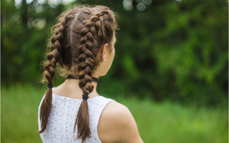 Image for a piece on French Braids and a corresponding style guide on how to wear them featuring Double Dutch Braided Pigtails