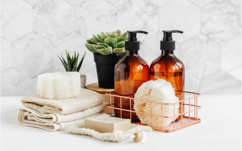 Tea tree oil shampoo sitting on a shelf in a basket
