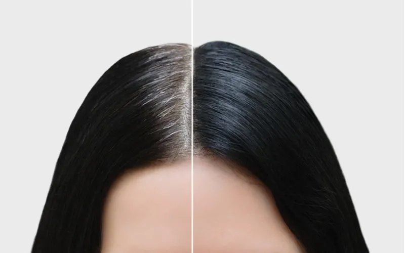 Woman who learned how to cover gray roots between salon visits
