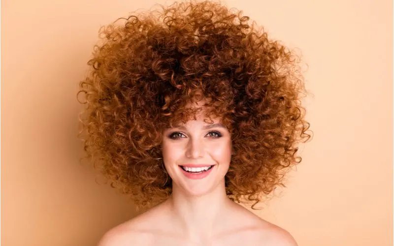 Lady who used a common perm type on her hair smiling