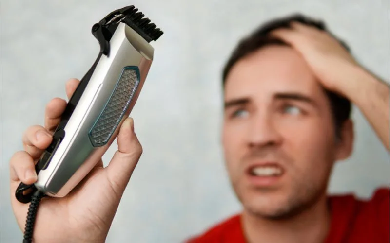 Guy showing us how to cut your own hair men with clippers