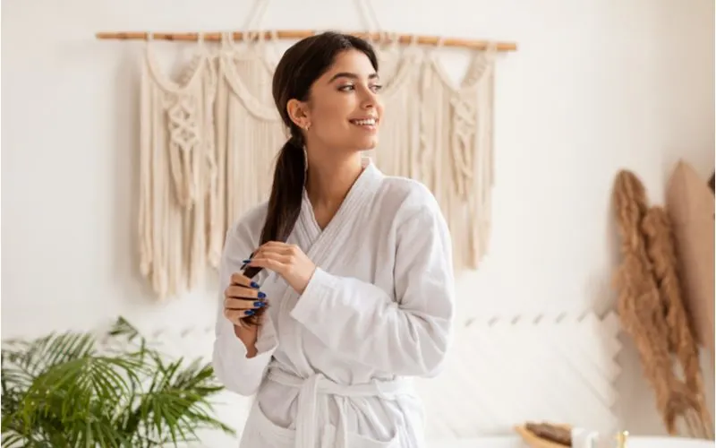 Woman showing us how to do an extended ponytail