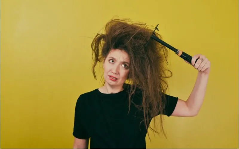 Woman with super frizzy hair who needs the best curl cream for wavy hair