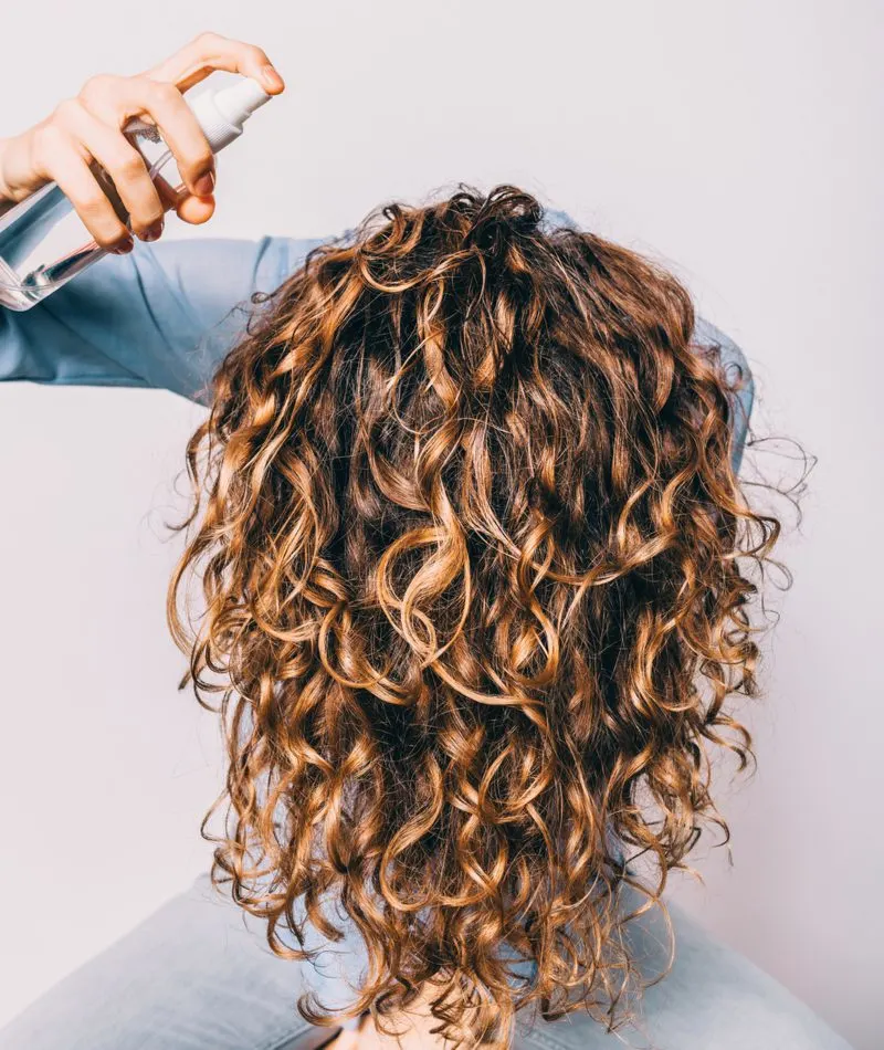 Woman who used curl cream and a diffuser on her 2c hair